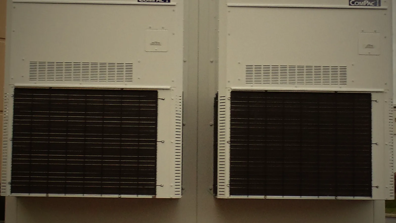 Two HVAC units mounted on the shelter's end wall