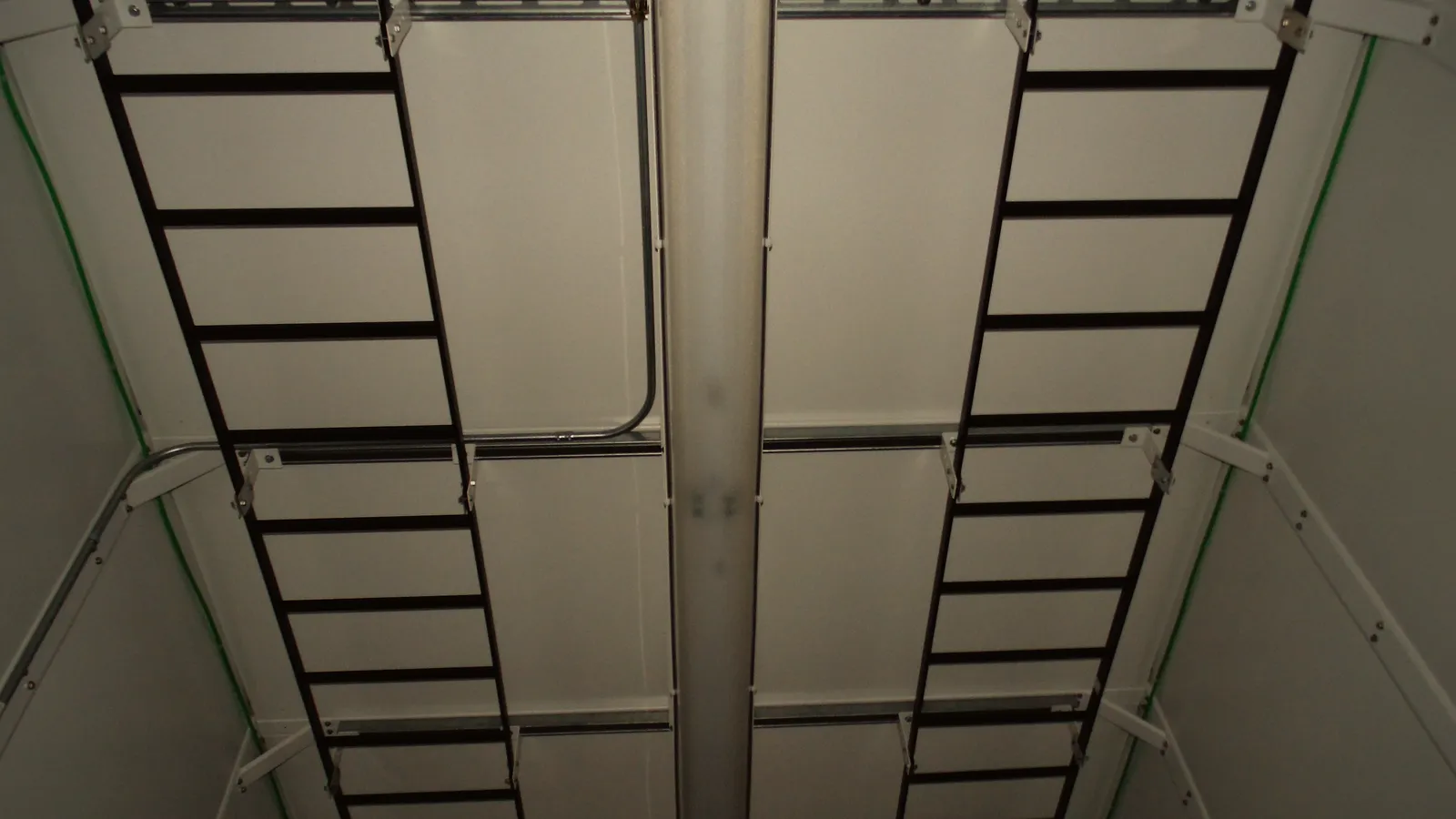 Cable ladders running along the inside of the shelter ceiling