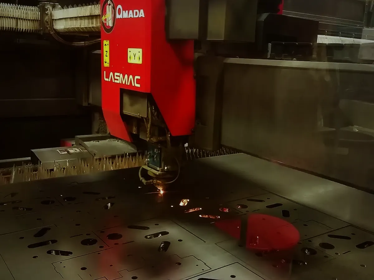 A laser head cutting parts from a steel sheet