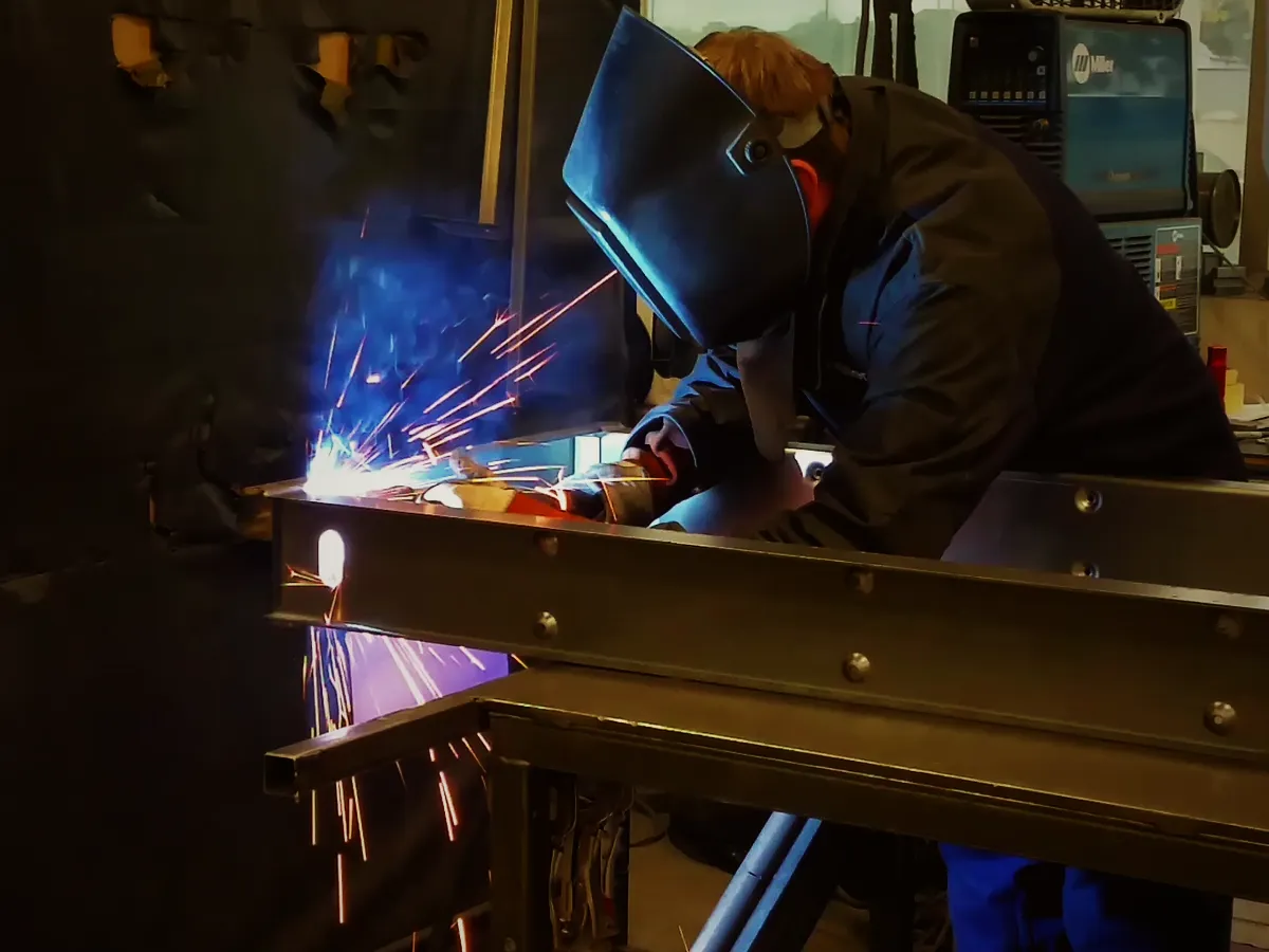 A welder at work, sparks flying