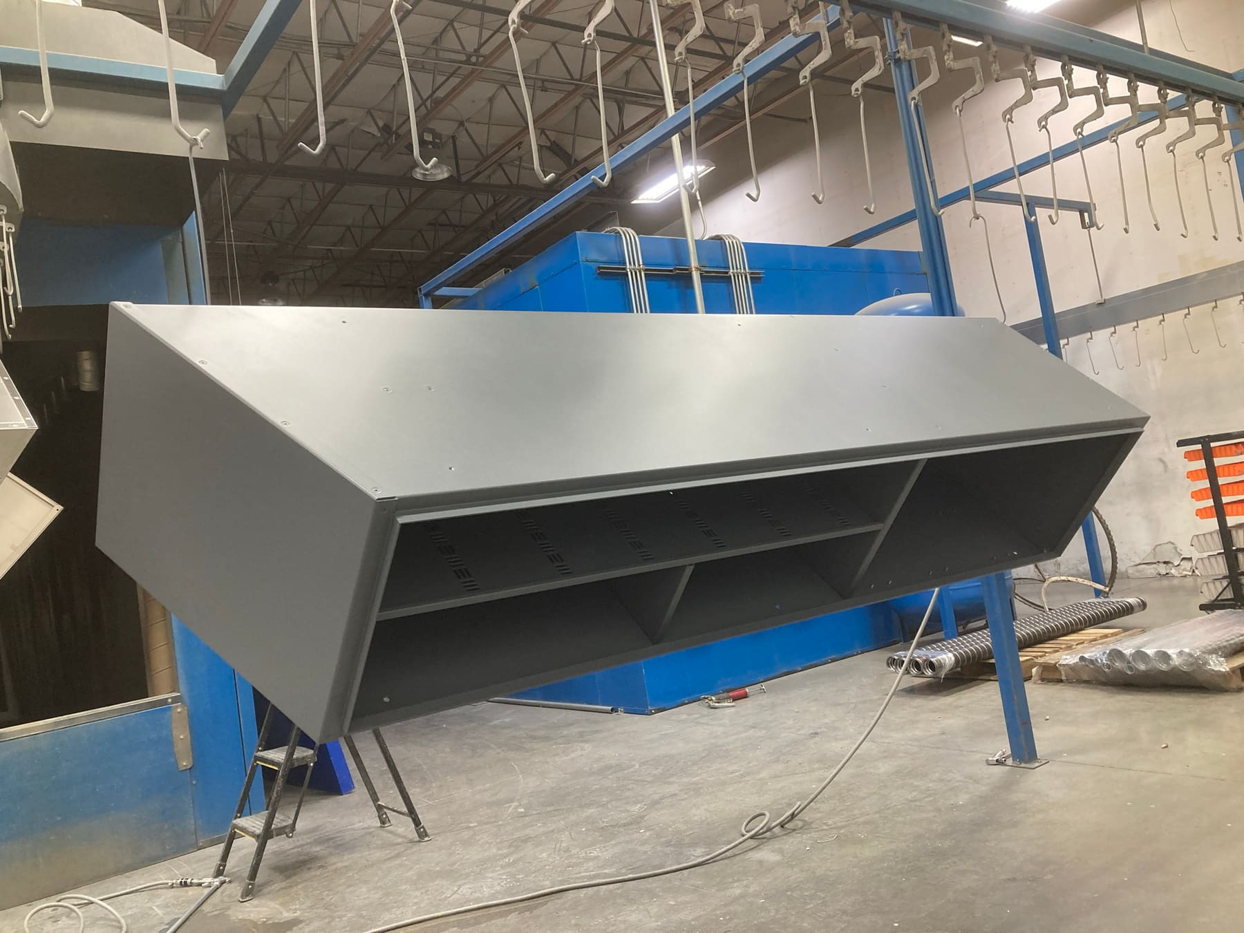 A large formed and welded sheet metal part on stands