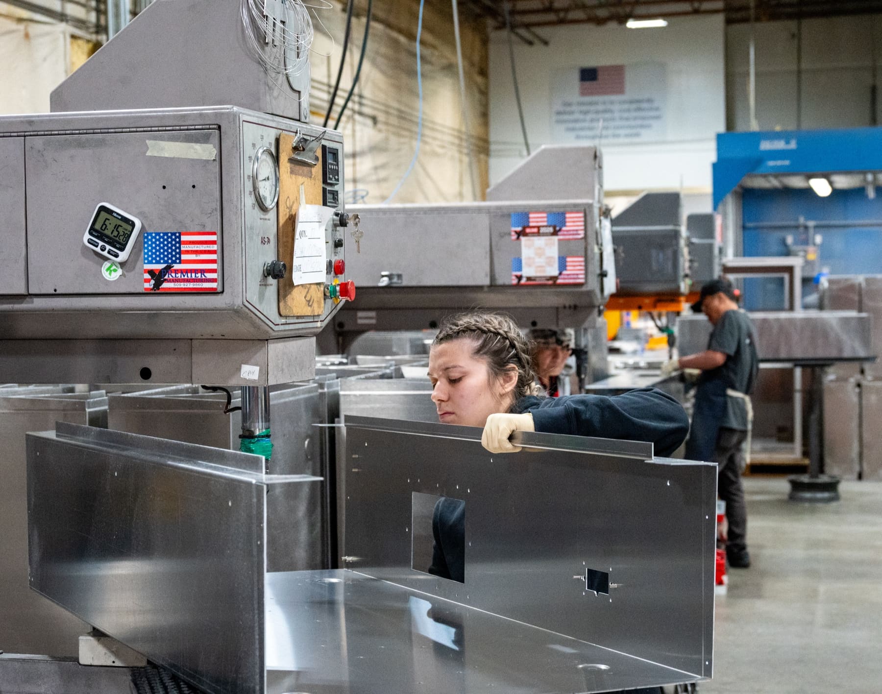 Operators forming stainless parts at the press brakes